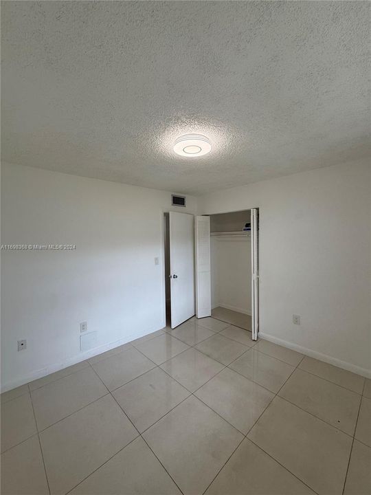 2nd bedroom with single closet.