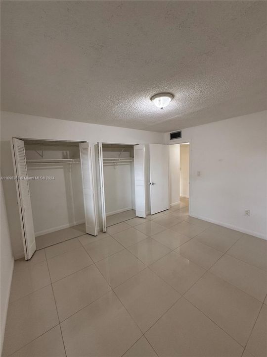 1st Bedroom includes his and hers closets.