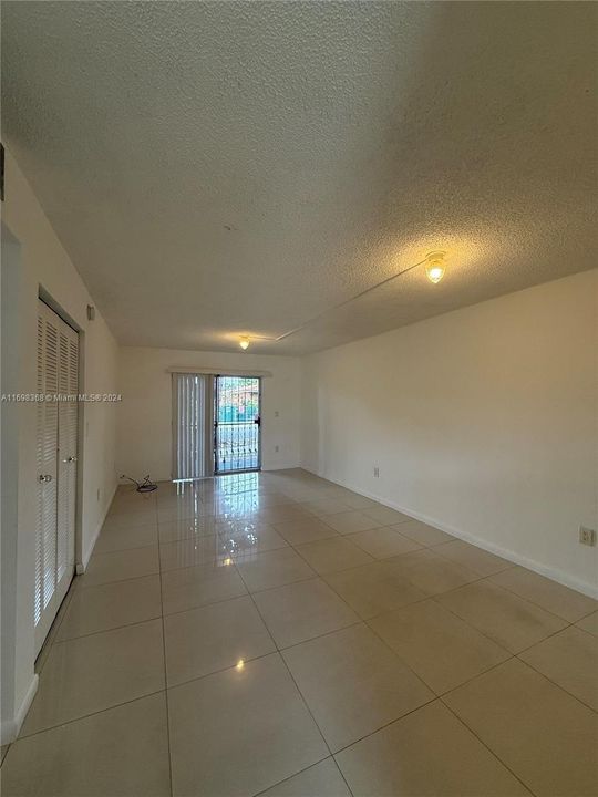 Spacious living area, with gated balcony.