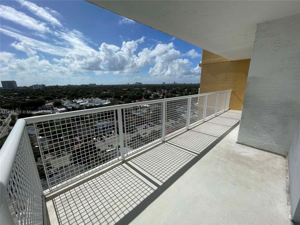 living room & bedroom open to large balcony