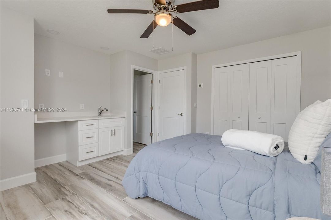 Main House Bedroom 2 with view to Kitchenette and Closet