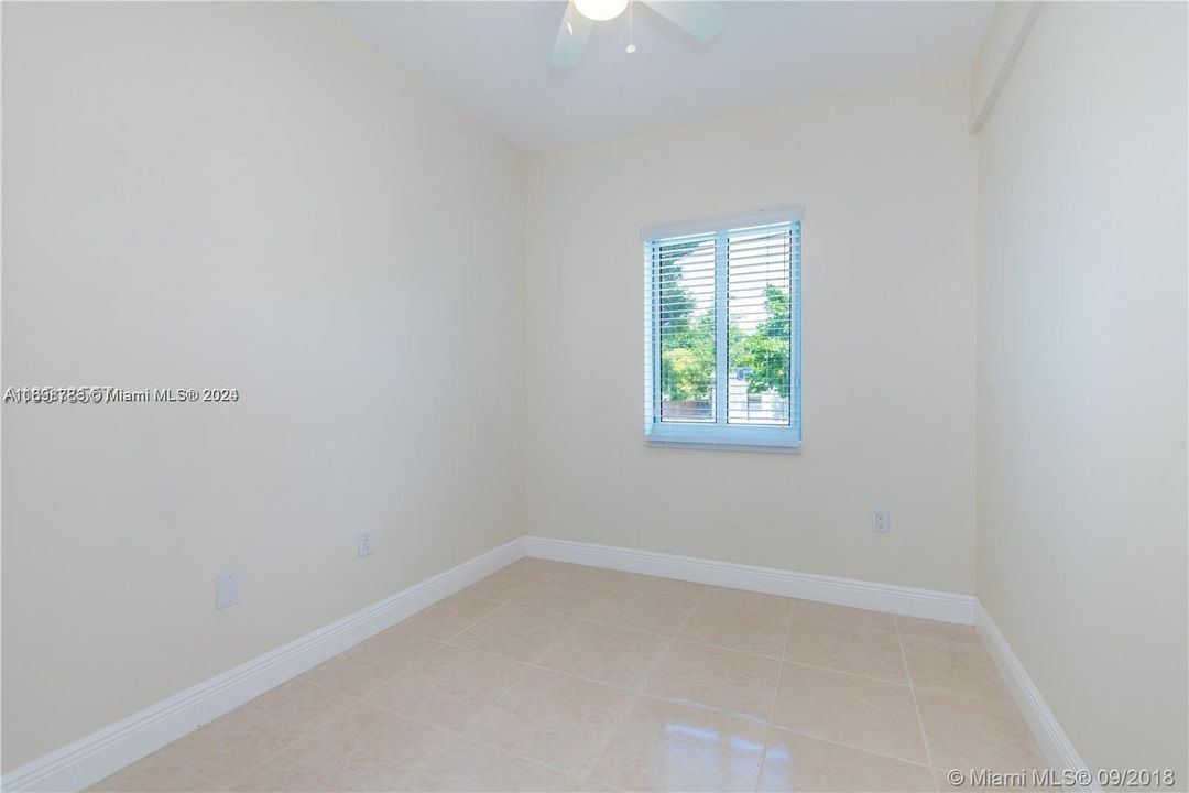 Small Bedroom with a closet and window