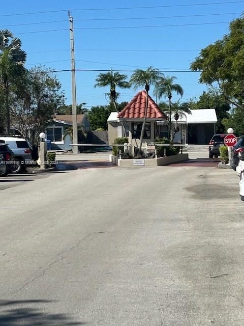 Front Entry of Complex w/ 24 Hour Security Guard Gate