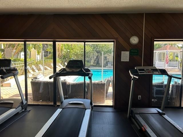 Treadmills facing the pool for relaxation