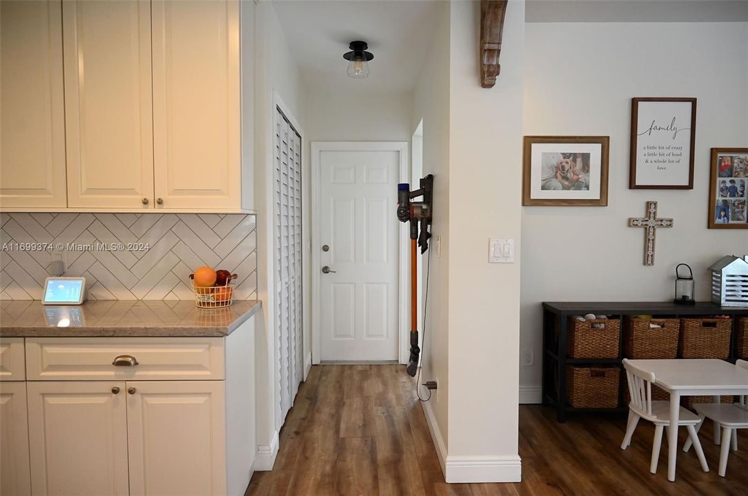 Hallway leading to pantry closet and garage