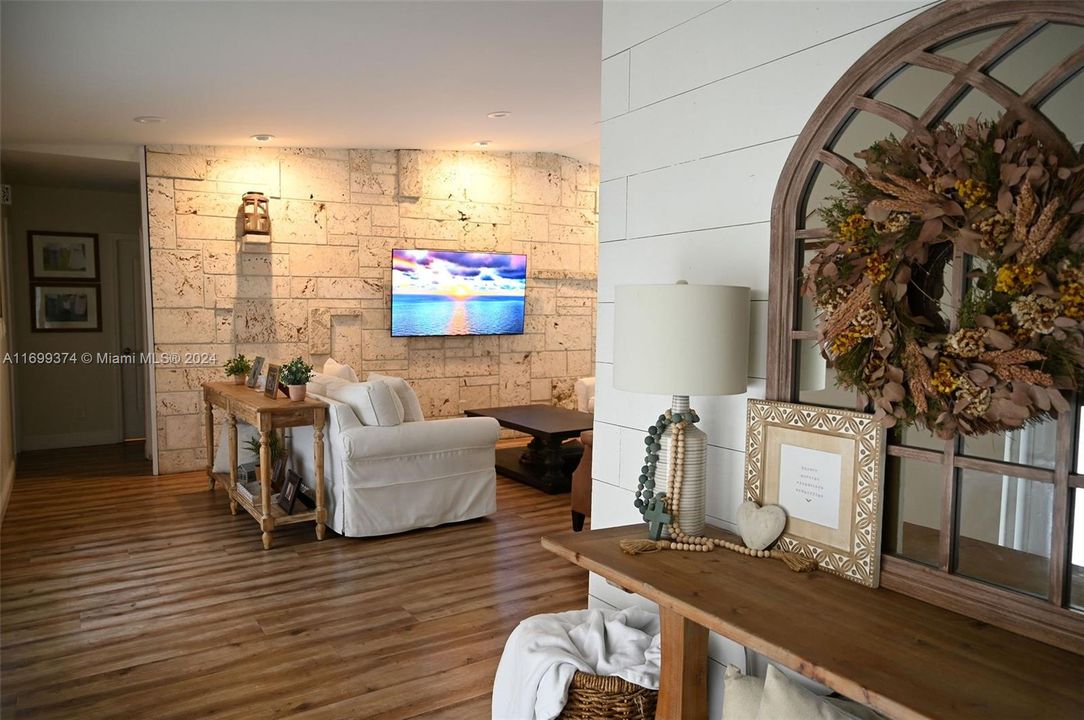 Beautiful Natural Coral Stone Accent Wall provides a warming feel.