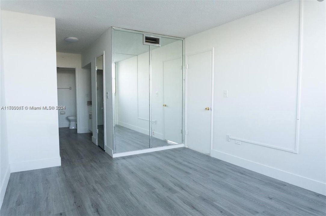 Bedroom hallway into bathroom