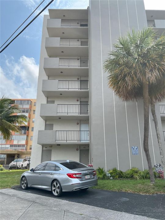 Entry doors to unit (behind parked car)