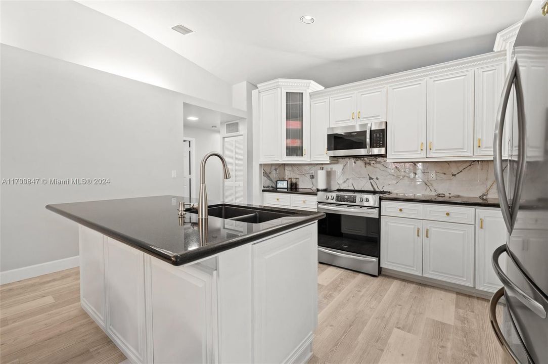 Kitchen island can accommodate bar stool seating.