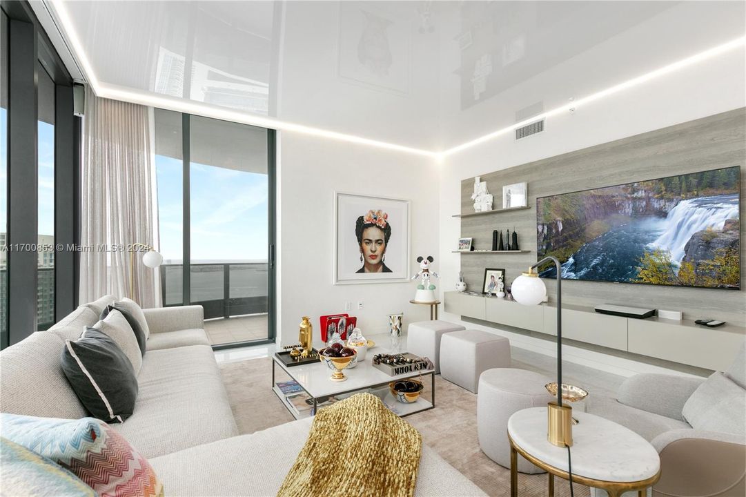 LIVING ROOM OVER LOOKING THE BAY VIEW AND BRICKELL CONDOS ARCHITECTURE