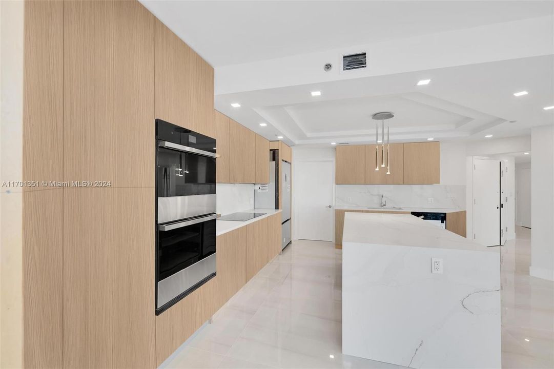 Wood Cabinets, Double Oven and Quartz Island