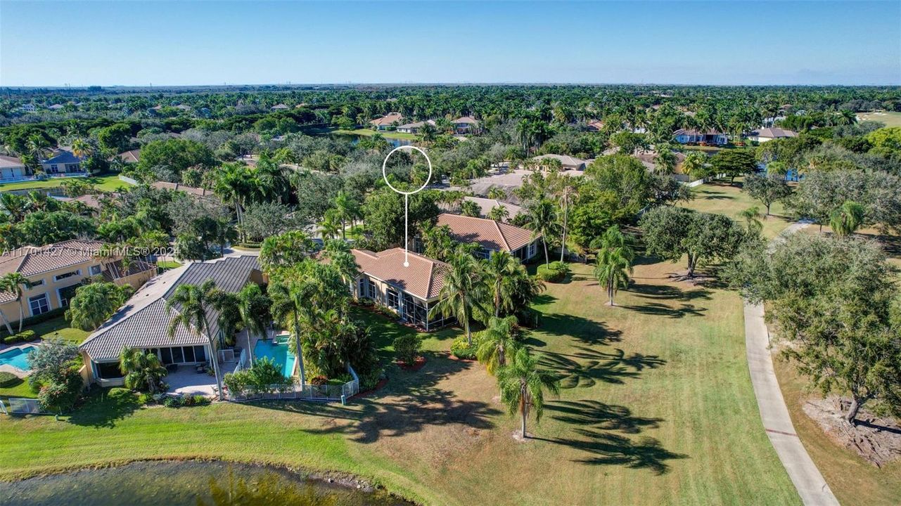 Lakes & golf views in all directions. Golf cart path leads to country club / tennis / pool (optional membership). Oversized lot for the neighborhood, pie shaped w/ separation from neighbors