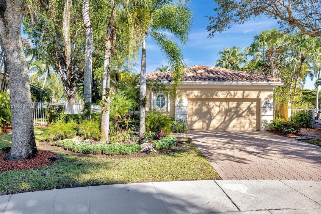 Beautifully landscaped front yard, with stepping stones to the backyard / golf course. Updated garage door. Roof 3 years old.