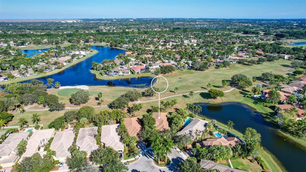 Lakes & golf views in all directions. Golf cart path leads to country club / tennis / pool (optional membership). Oversized lot for the neighborhood, pie shaped w/ separation from neighbors