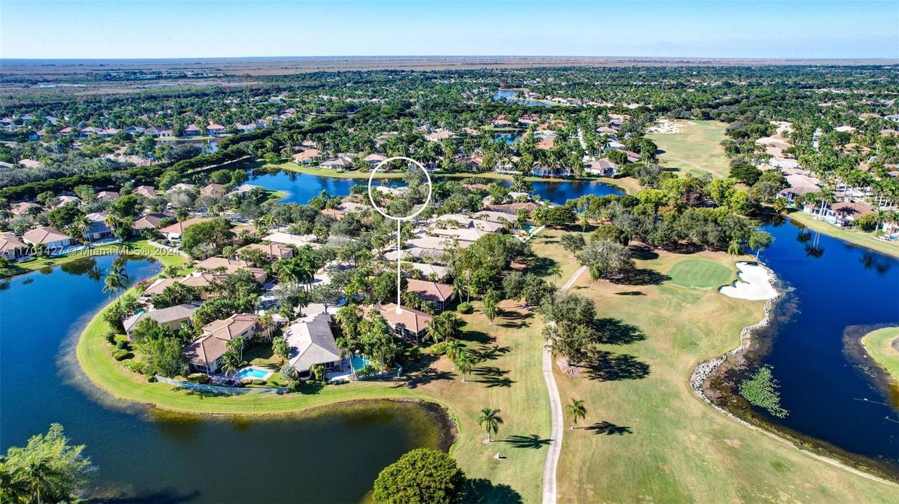 Lakes & golf views in all directions. Golf cart path leads to country club / tennis / pool (optional membership). Oversized lot for the neighborhood, pie shaped w/ separation from neighbors