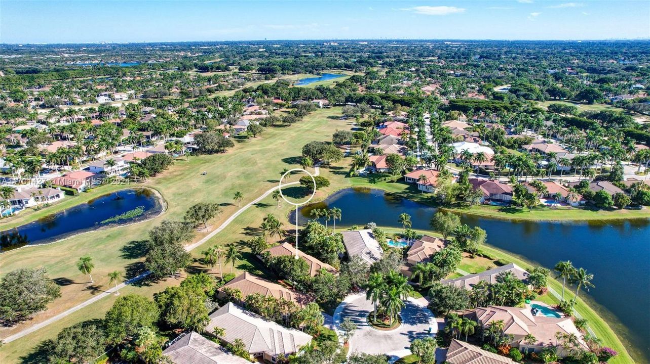 Lakes & golf views in all directions. Golf cart path leads to country club / tennis / pool (optional membership). Oversized lot for the neighborhood, pie shaped w/ separation from neighbors