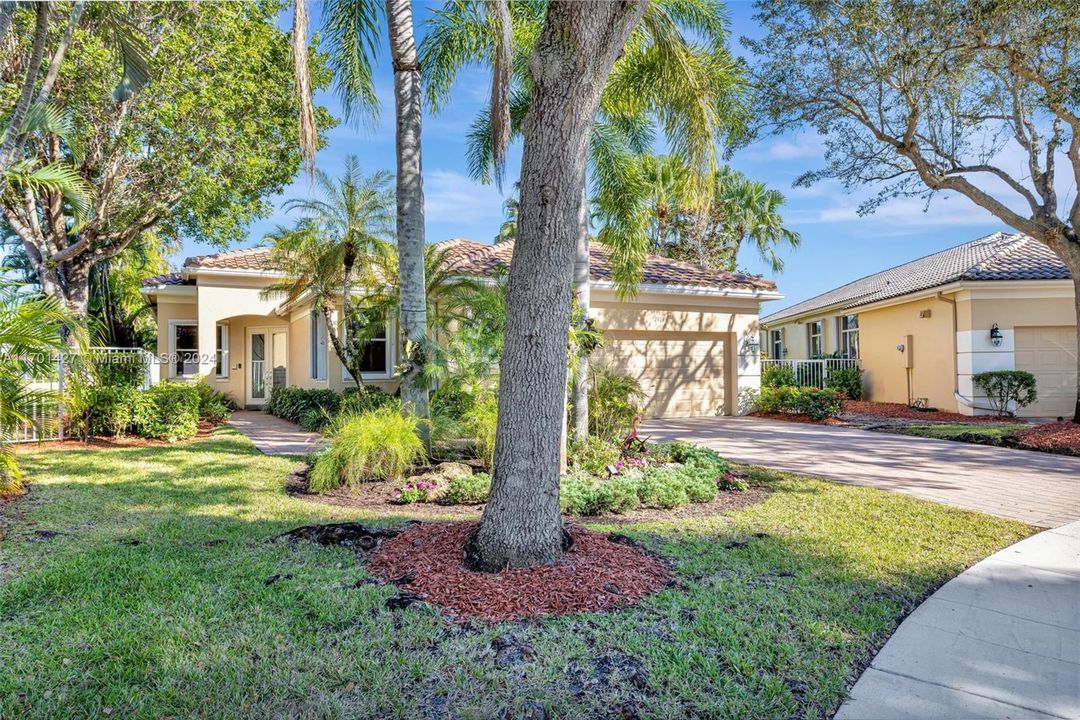 Beautifully landscaped front yard, with stepping stones to the backyard / golf course. Updated garage door. Roof 3 years old.