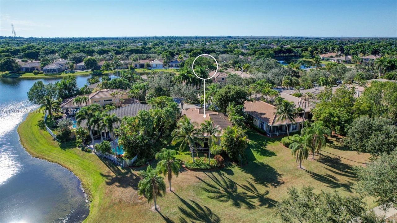 Lakes & golf views in all directions. Golf cart path leads to country club / tennis / pool (optional membership). Oversized lot for the neighborhood, pie shaped w/ separation from neighbors