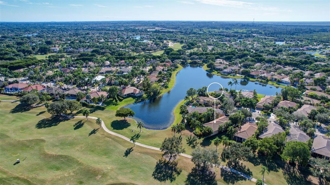 Lakes & golf views in all directions. Golf cart path leads to country club / tennis / pool (optional membership). Oversized lot for the neighborhood, pie shaped w/ separation from neighbors