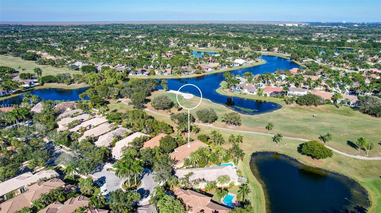 Lakes & golf views in all directions. Golf cart path leads to country club / tennis / pool (optional membership). Oversized lot for the neighborhood, pie shaped w/ separation from neighbors