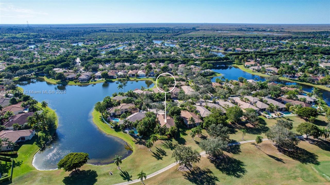 Lakes & golf views in all directions. Golf cart path leads to country club / tennis / pool (optional membership). Oversized lot for the neighborhood, pie shaped w/ separation from neighbors