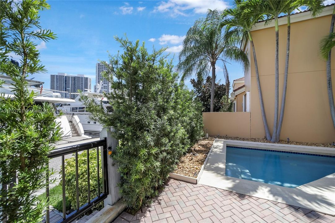 Pool area and gate with access to the waterways marina, shops and restaurants