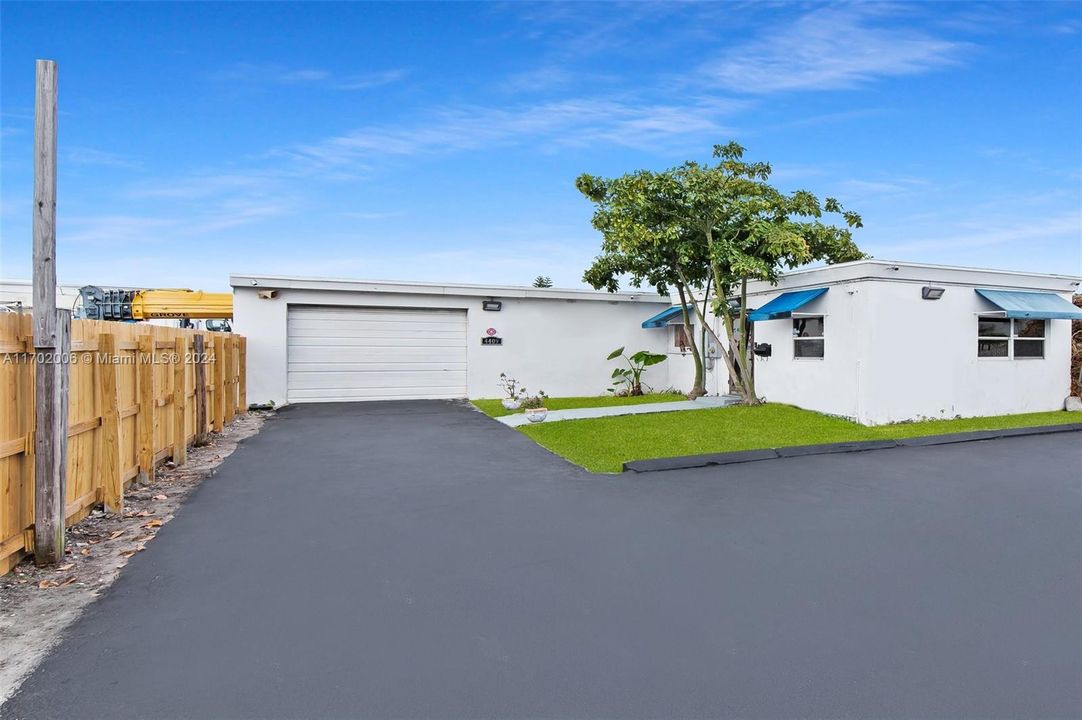 Front elevation featuring extra long driveway for Trailers