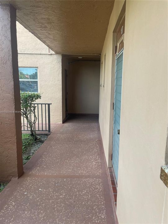 Hallway from Front Door to Close Laundry Facilities.