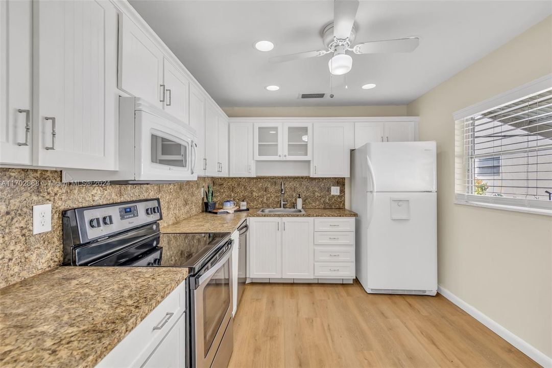 KITCHEN WITH LOTS OF CABINETS AND COUNTER SPACE