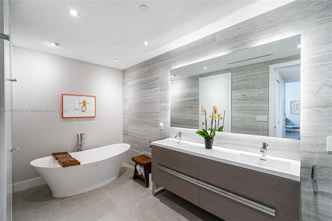 Fully Custom Primary Bathroom Upgraded with Procelain Stone, Backlit Mirror, Stand Alone Tub.