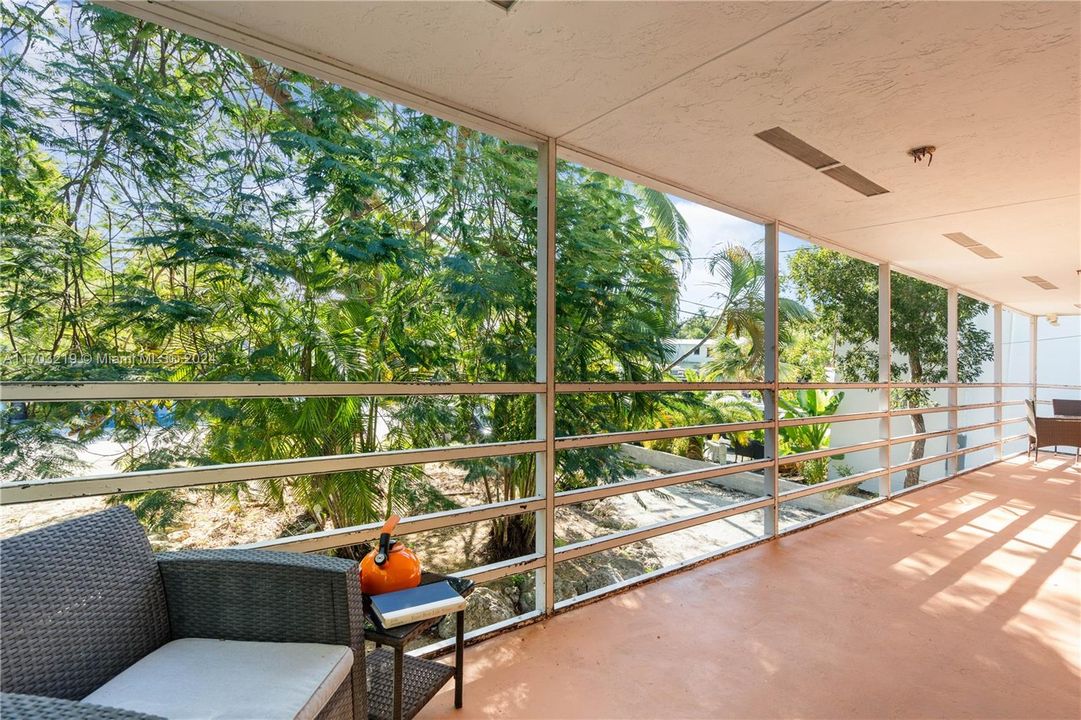 Enormous Veranda offers lush views and is the ideal spot for tropical serenity.