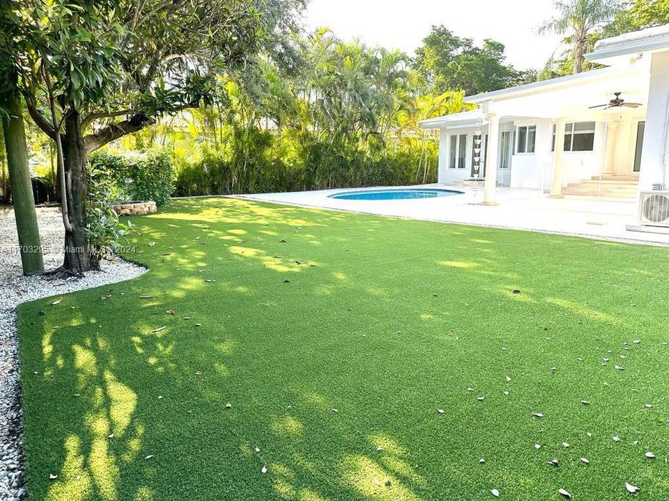 Beautiful backyard with artificial turf and saline pool