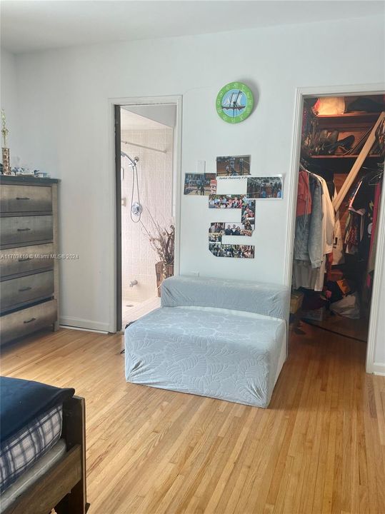 Bedroom with ensuite bathroom and walk-in closet.