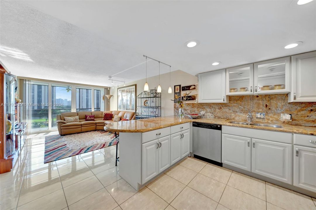 Renovated open Kitchen with views to the Living Room and Golf Course.