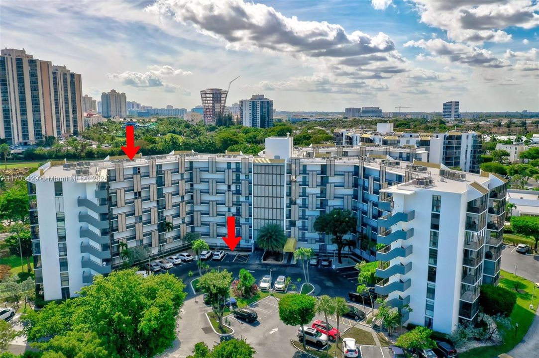 Assigned parking space steps away from door - red arrow ground level