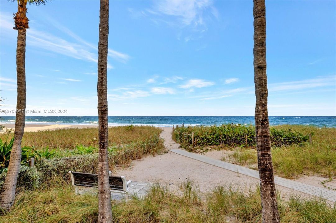 Beach access right from pool area. Imagine you sitting on this bench in the seagrass. . .