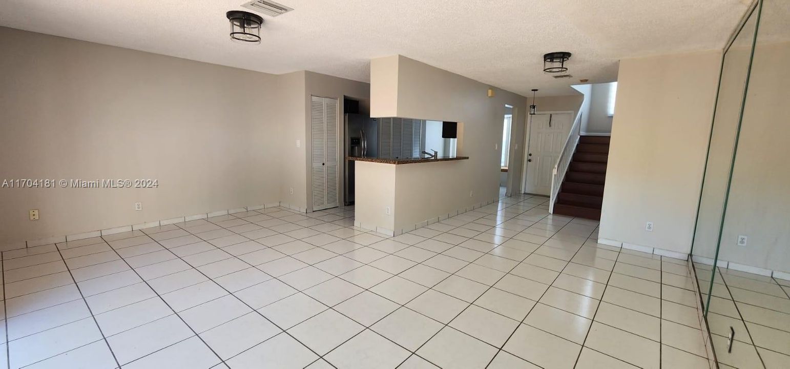 Large living-dining area leading to fenced patio. Great for entertaining.