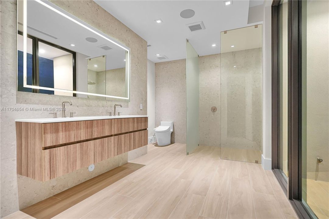 Primary Bath with Walk-In Shower, Dual Vanities and Backlit Vanity Mirror