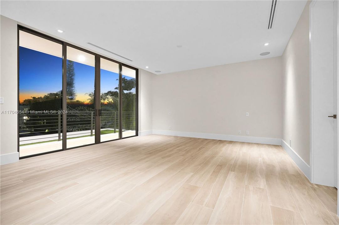 Primary Bedroom with large His and Her Closet Spaces