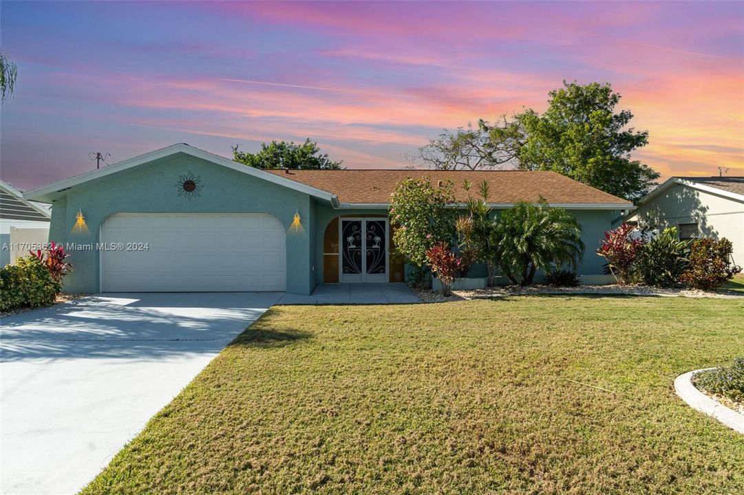 Front with 2 car garage