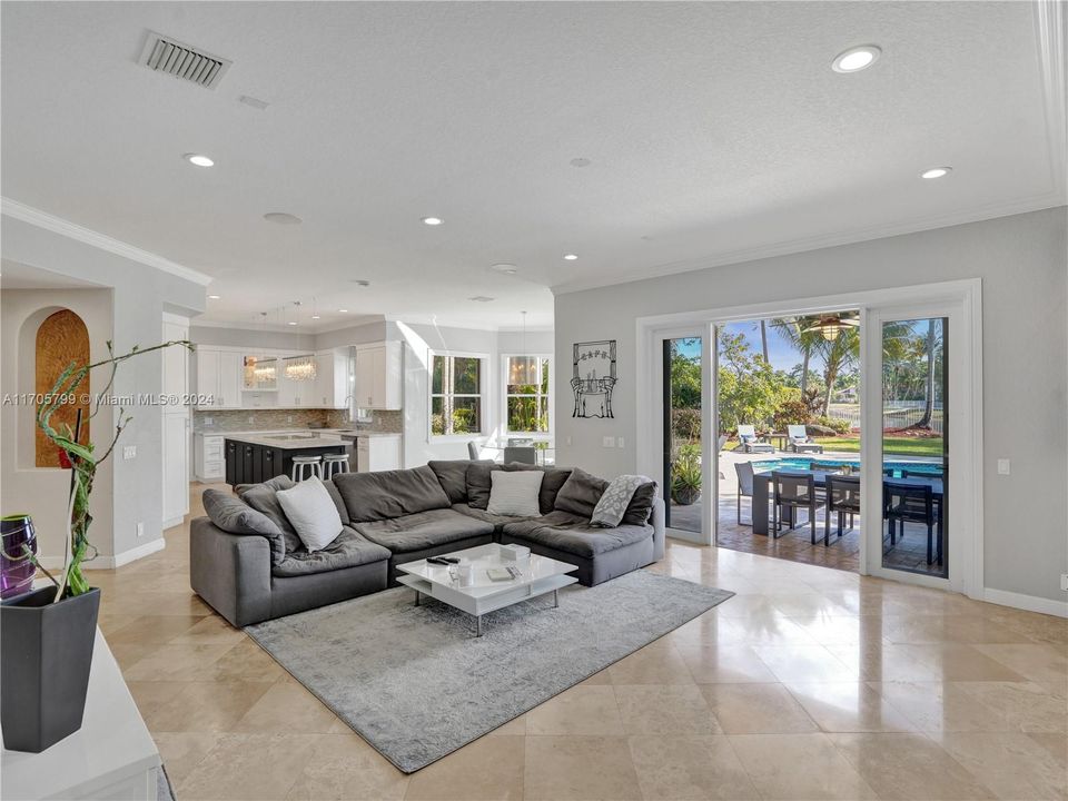 Large family room with views of the lake and pool