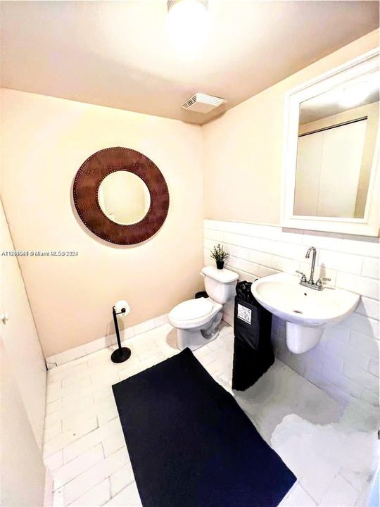 1st Floor 1/2 guest bathroom with full size washer and dryer