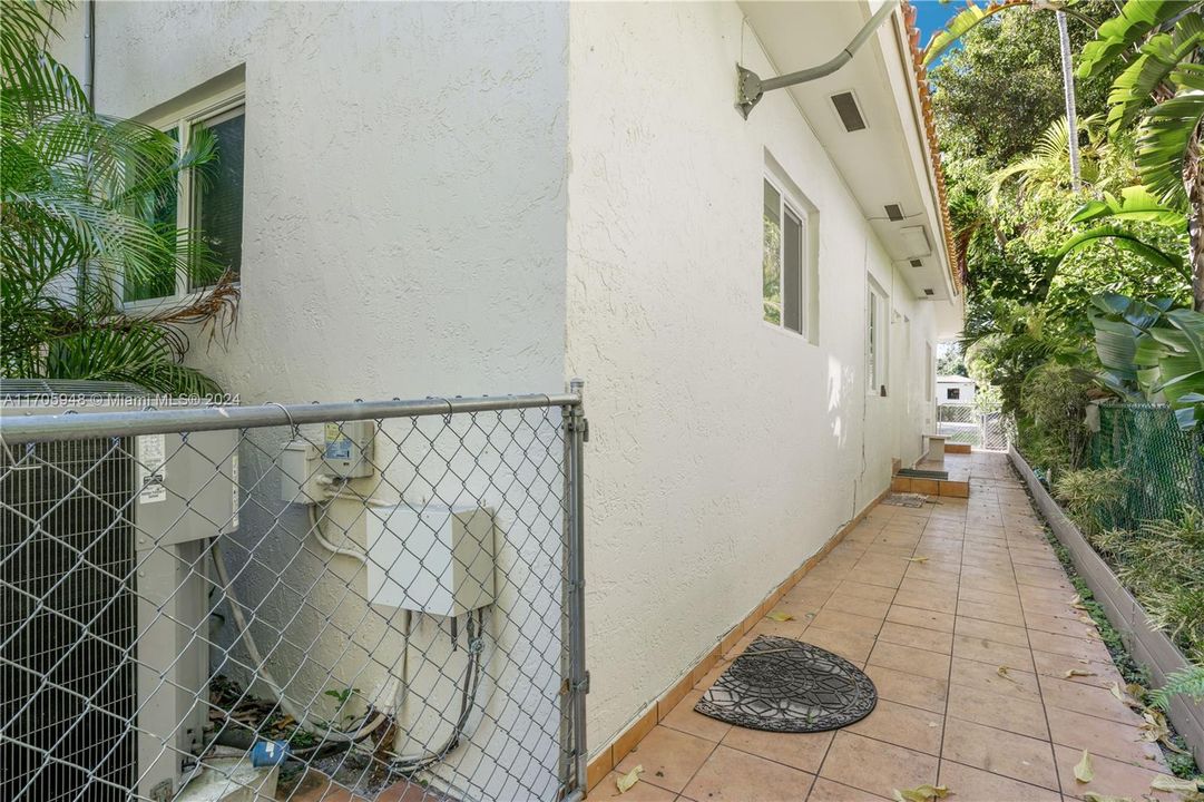 West side of house has a tiled walkway which makes it nice and clean, no splashing mud or dirt on the side of the house.