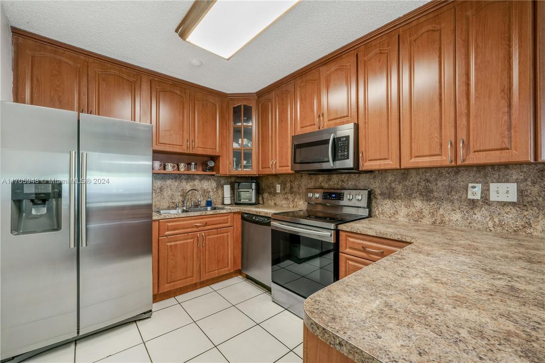 Newer kitchen appliances and plenty of cabinet space.