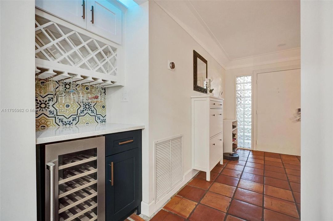 Wine Fridge and Bar area between the Living room and family room!