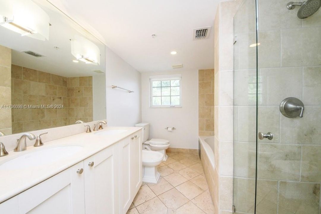 Master bath with double vanity, tub and shower