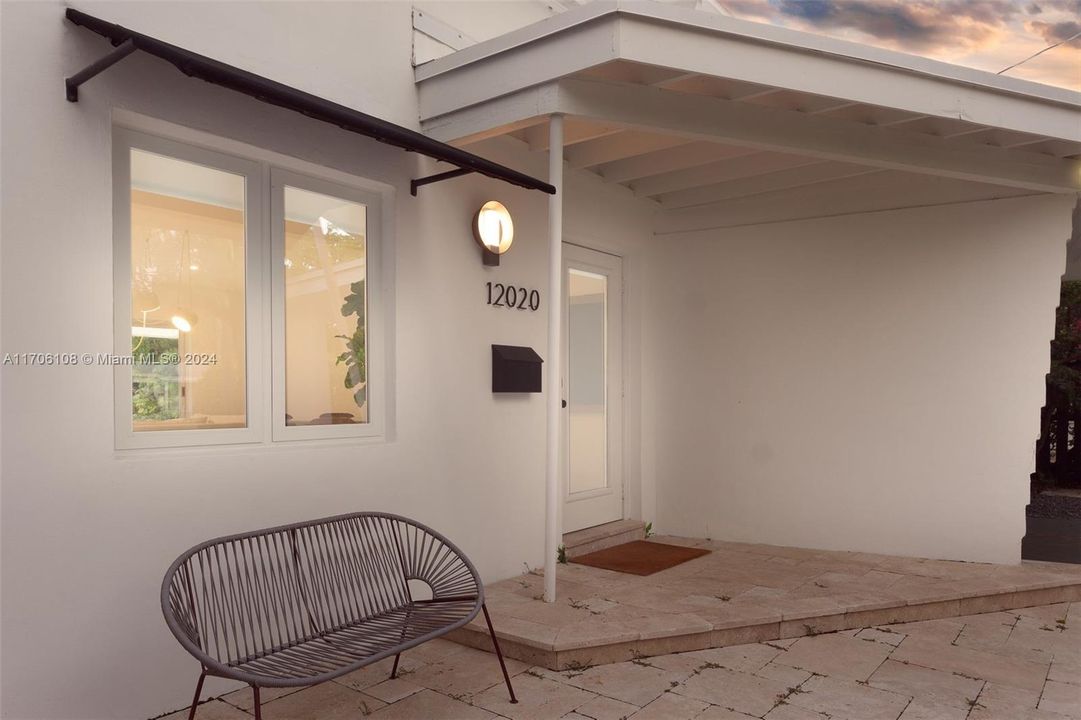 Beautiful covered entryway to this private oasis home.