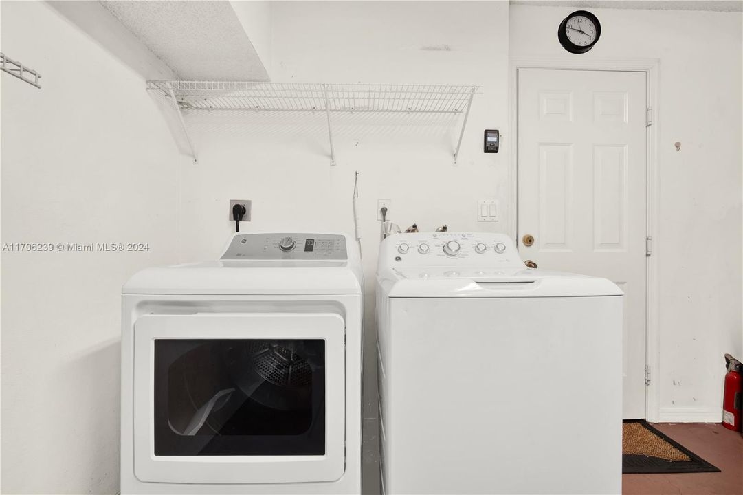 Washer and drying inside the garage.