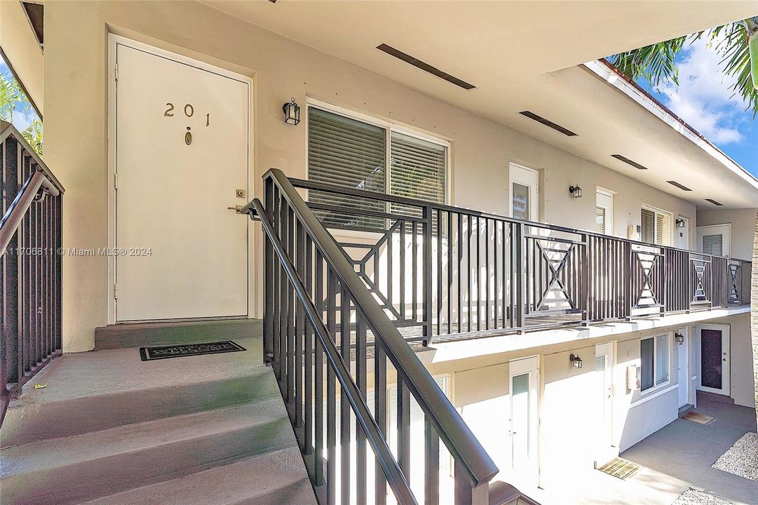 Entrance to the this second floor unit. Unit has storm shutters for all windows.