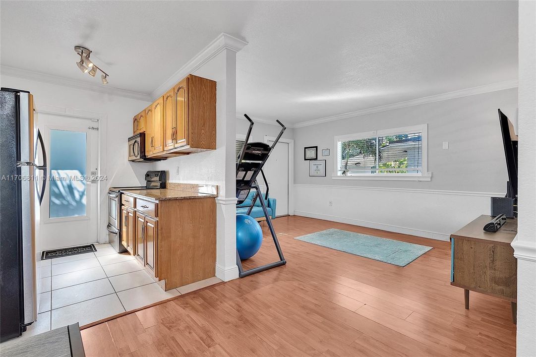 View of kitchen and living room viewed from dining area.